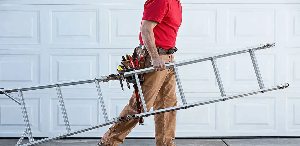 Garage door repair technician arriving with tools and ladder in Wilmington, NC
