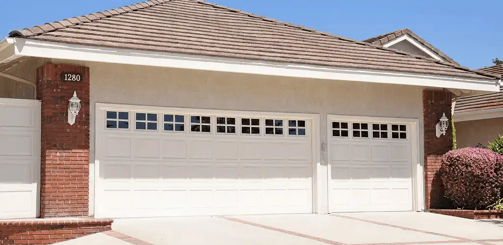 Residential garage door repair service for a double garage door in Wilmington, NC