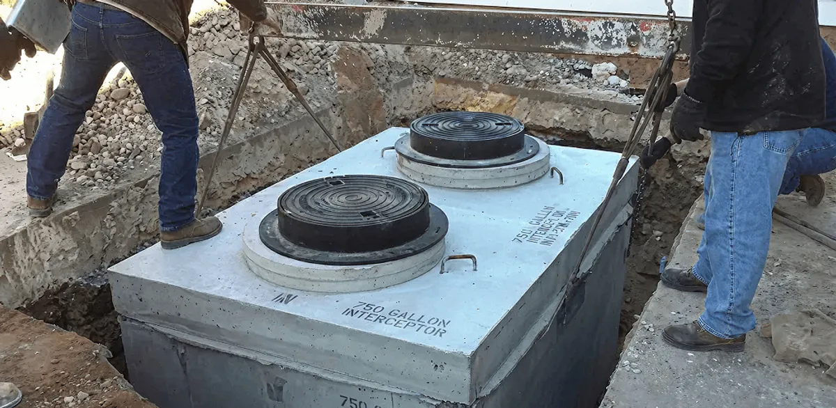 Grease trap installation for a commercial property drainage system in Wilmington, NC