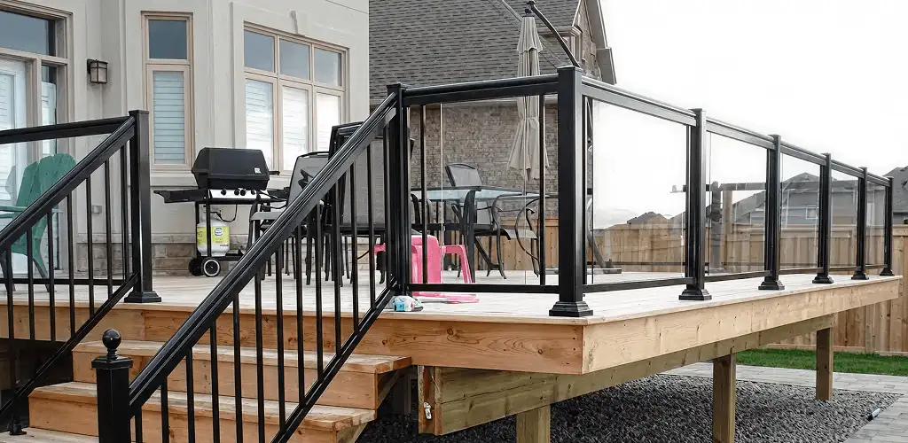 Handrail installation on a deck staircase for safety and code compliance in Wilmington, NC