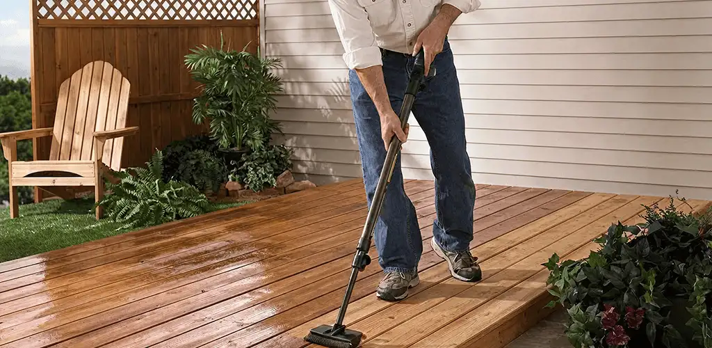Deck staining service applying stain to a backyard wood deck in Wilmington, NC